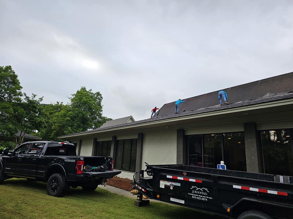 JJ Roofing crew on site with the company trailer following a two-story coastal re-roof in Ridgeland, South Carolina